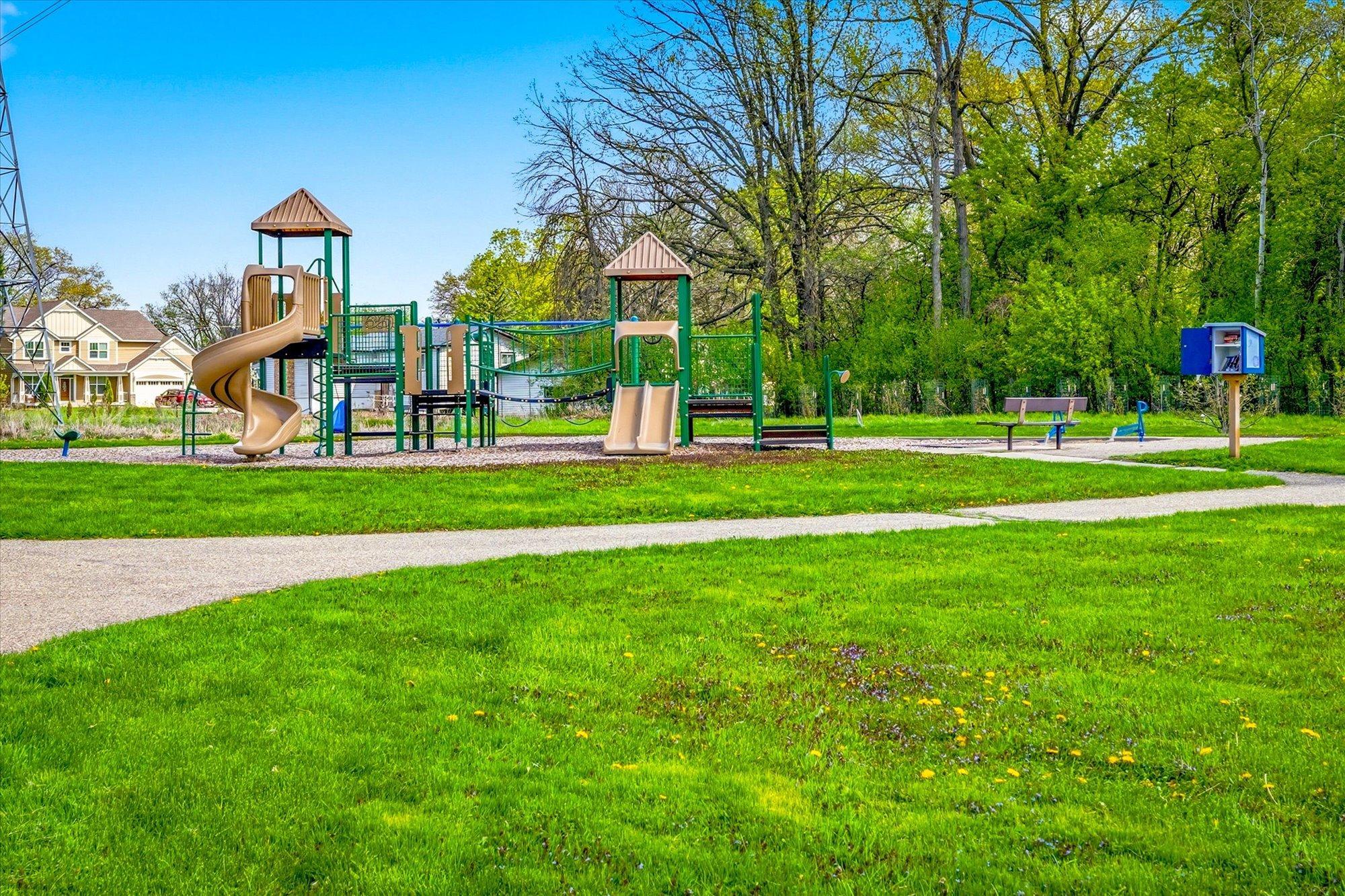 Neighborhood playground and park area located nearby for outdoor recreation and fun. Conveniently located near parks, shopping, restaurants, trails, and everyday amenities with easy access throughout the Twin Cities.