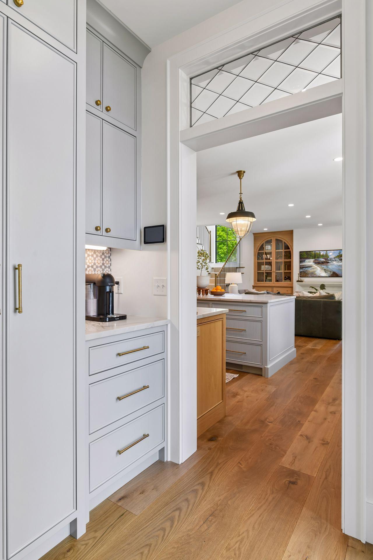 Perfect spot for the coffee bar. Pantry is on the left and a door leads to the deck from this space. Another view of the gorgeous leaded glass transom windows.
