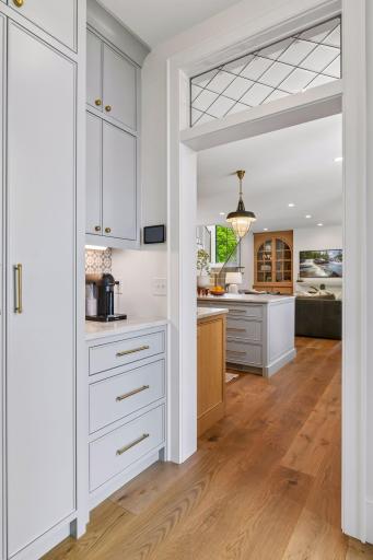 Perfect spot for the coffee bar. Pantry is on the left and a door leads to the deck from this space. Another view of the gorgeous leaded glass transom windows.