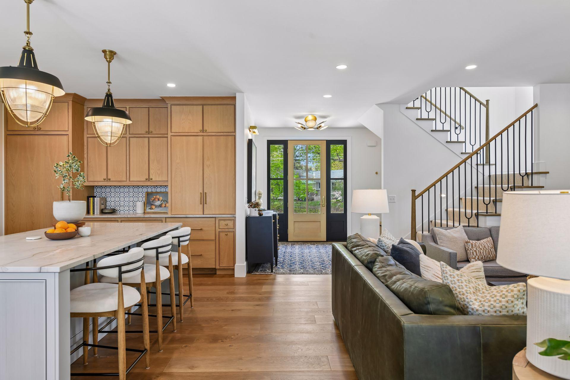 Warm and inviting entry. The light fixtures are amazing throughout the home. Custom balusters on the staircases. All furniture is available for sale.