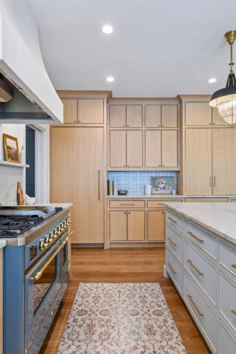 Beautiful custom inset cabinetry hides the sub-zero fridge, freezer drawers, microwave, etc.
