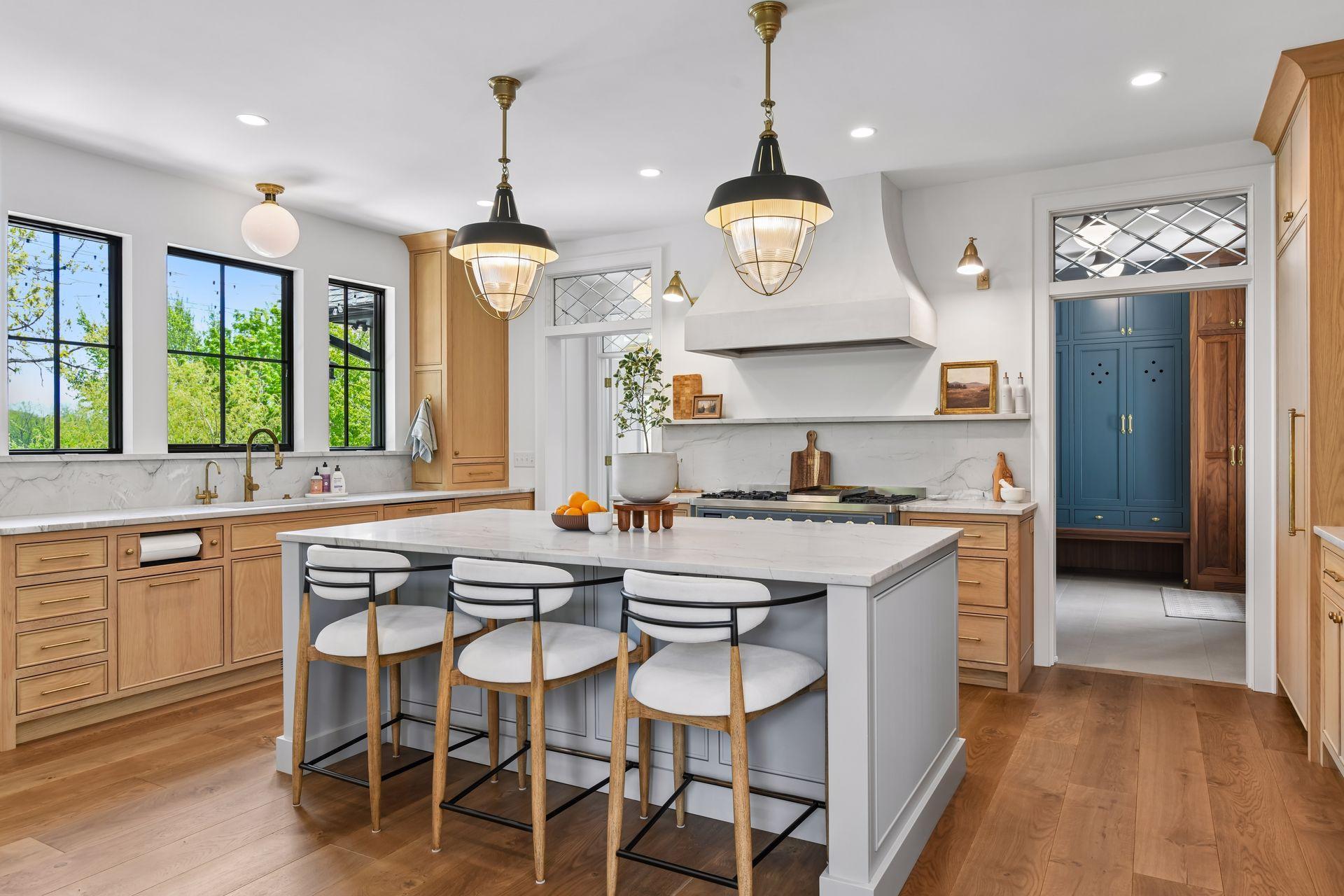 Large open Quartzite island is perfect for food prep or for hanging out to watch the cook. Gorgeous lead glass transom windows complete every room entrance on the main floor.