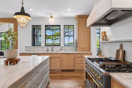 Another kitchen view. Clean up is pleasant when you can look out over the lake. Instant hot water and cold drinking water through the RO faucet. Unlacquered brass faucets and hardware patina naturally over time.