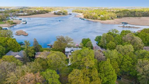 Aerial view of what you see from the rooms in the house. Seton Lake is quiet and perfect for fishing, paddleboarding, kayaking, etc. but still has access to the bigger and busier portions of Lake Minnetonka. One channel is straight ahead.