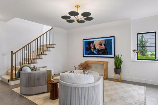 Add a cabinet to the left of the TV, a console under the TV and a banquette with storage under the window. Plans and selections are available to finish this space.