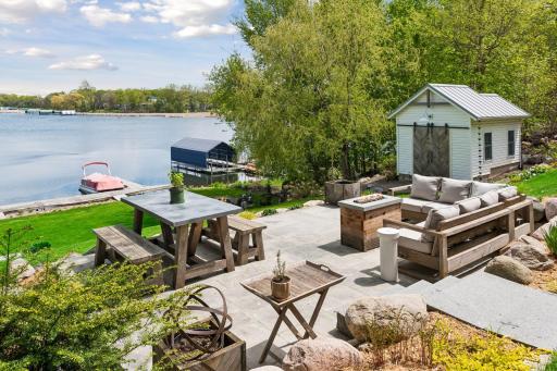 Spacious paver patio with boulder surround. Granite steps provide easy access from the front yard to the patio and then down to the lake.