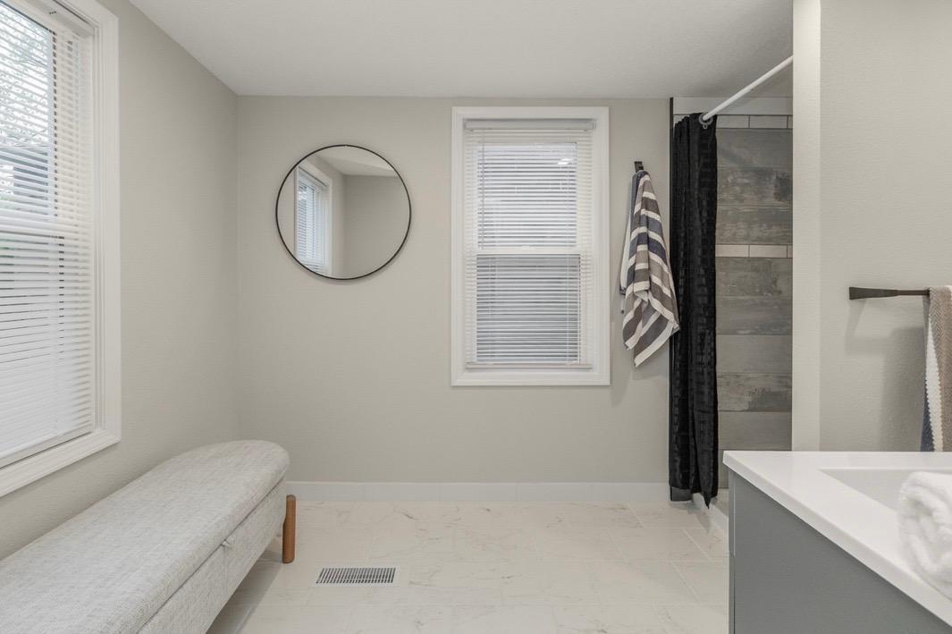 Large main floor bathroom with shower