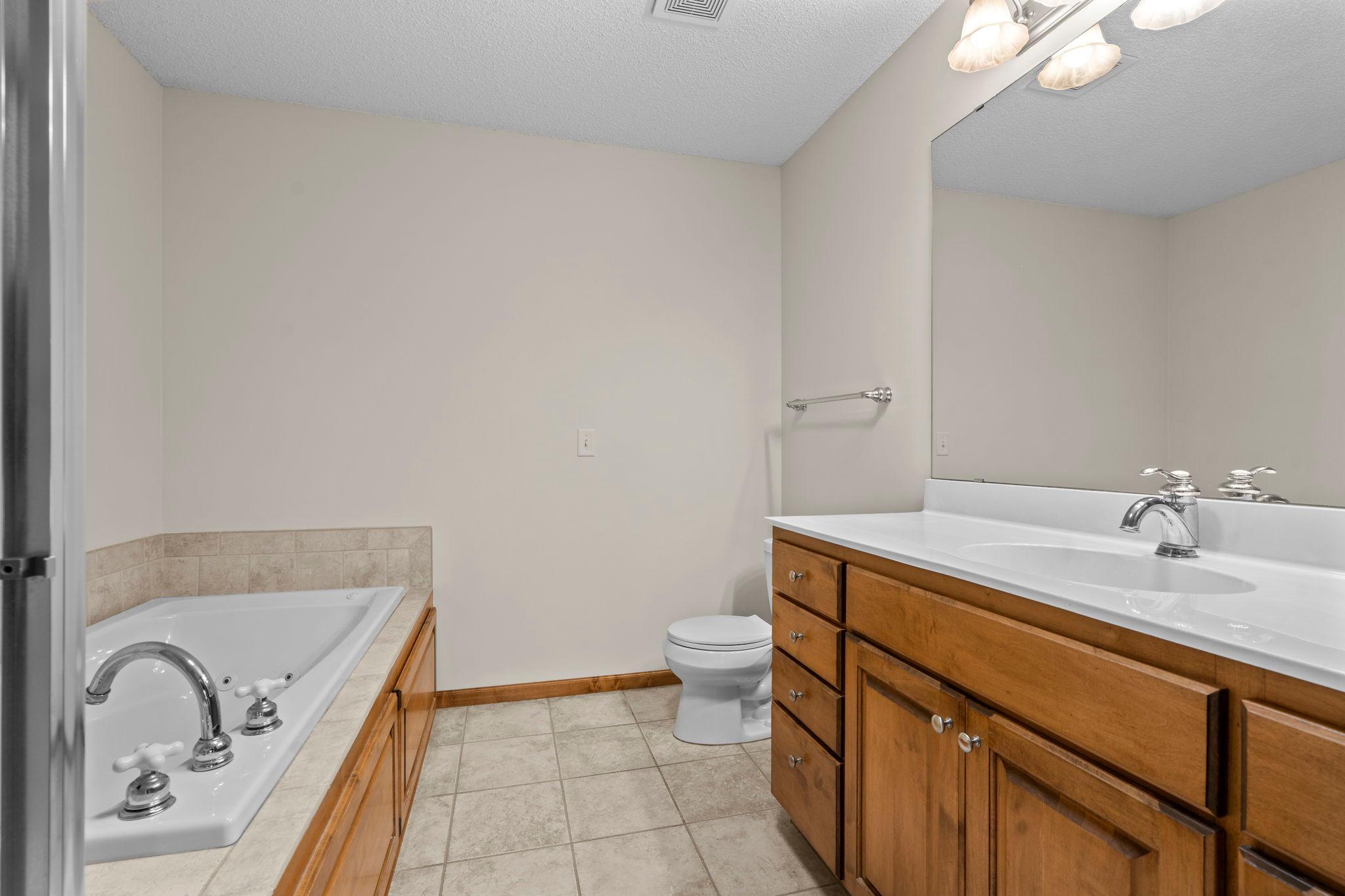 Primary with private bathroom. Seperate shower and soaking tub.