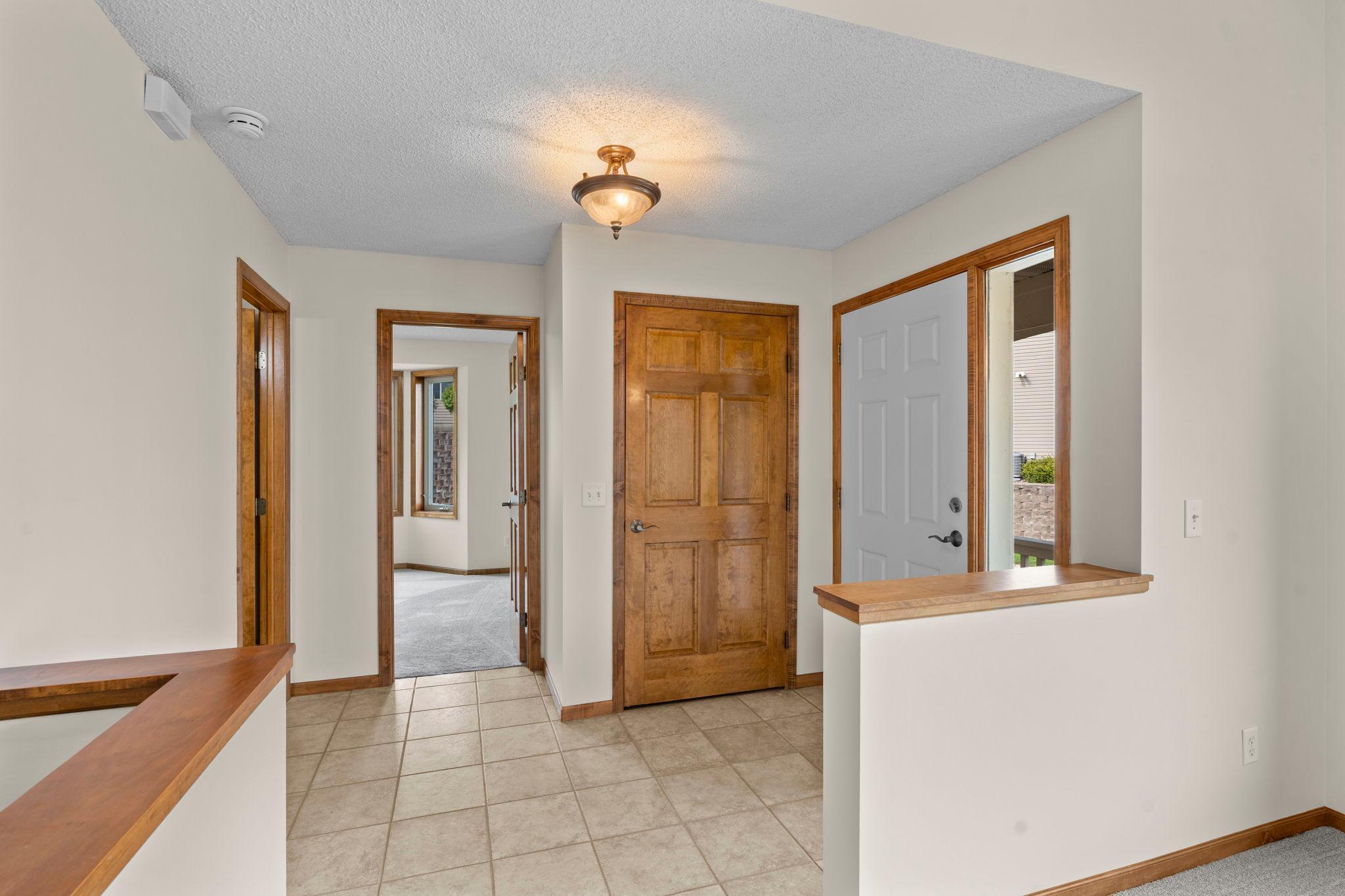 Welcome foyer with tiled floors.