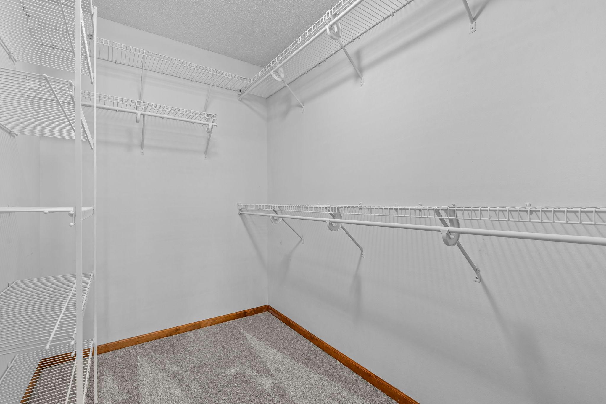 Large primary walk-in closet.