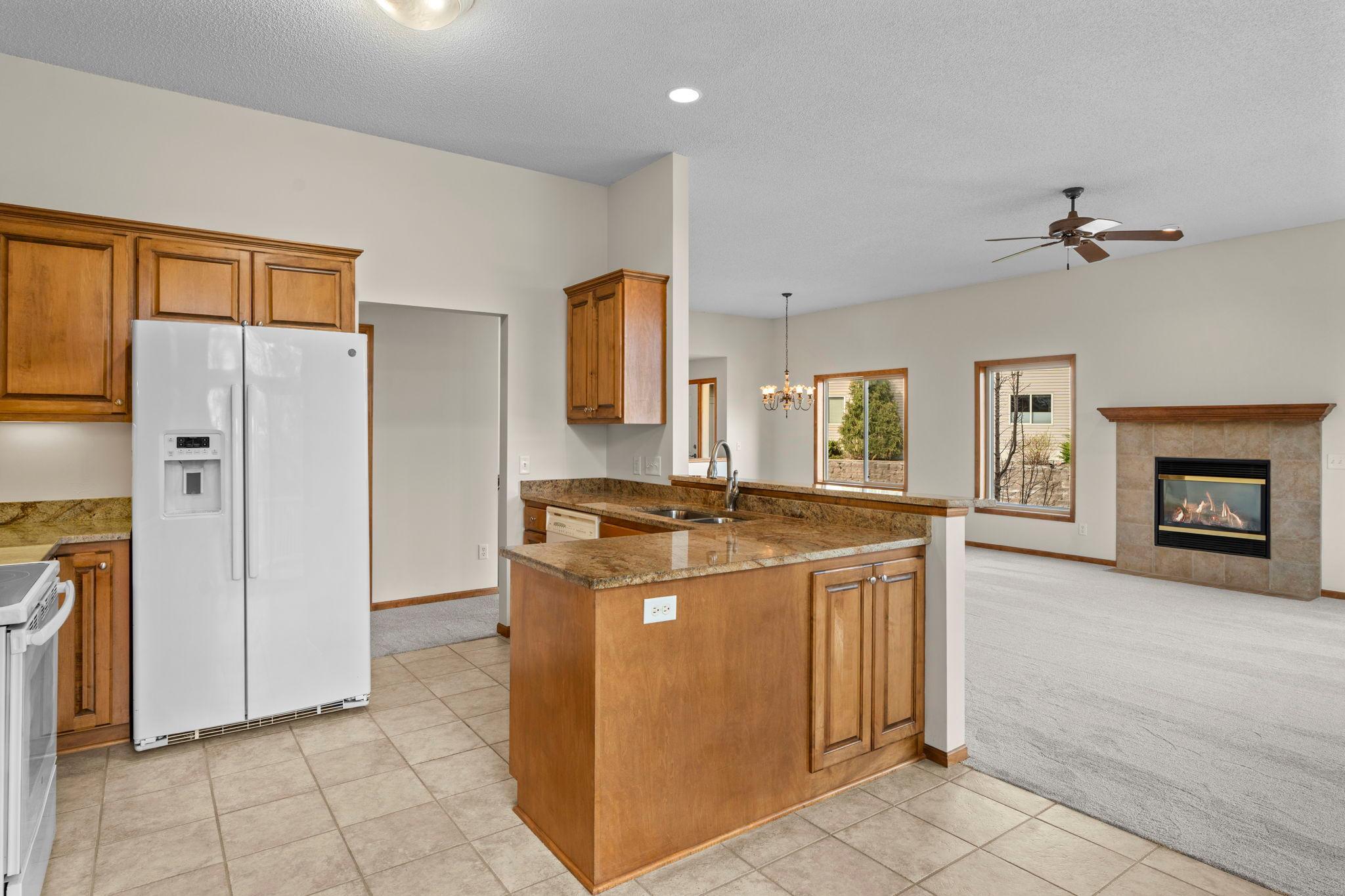 High ceilings create a warm and open floor plan. Beautiful ceramic tiled floors in the kitchen.
