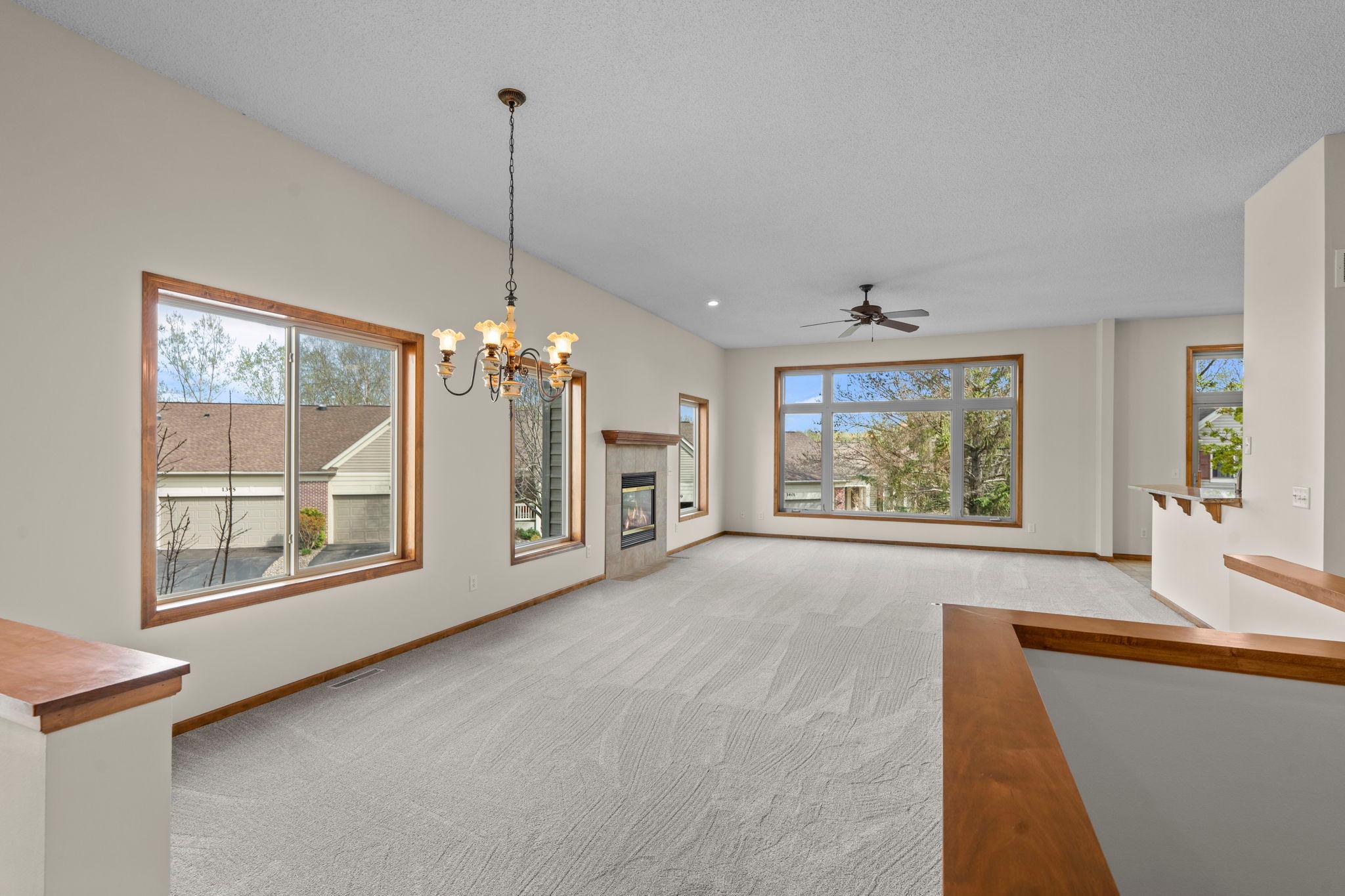 Spacious main level with informal dining, living room, a ton of windows and a cozy, gas fireplace.