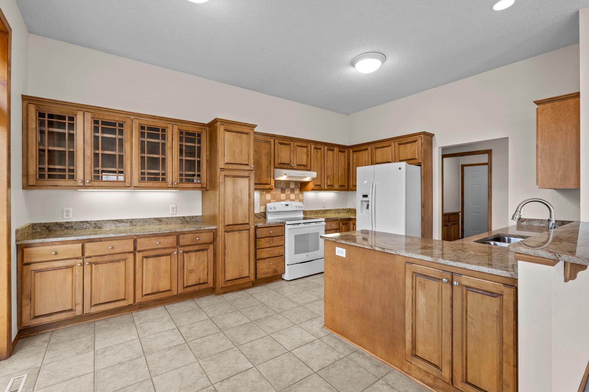 Abundance of kitchen cabinetry and Granite Countertops.