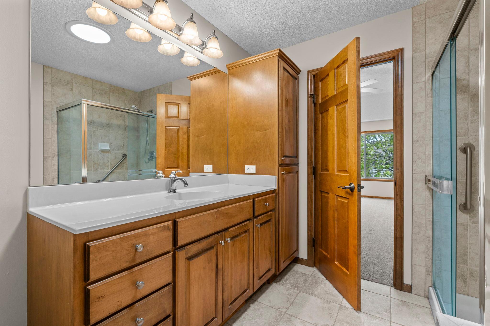 Beautiful woodwork, cabinetry, and natural wood 6 panel doors. Ceramic tiled floors and shower.