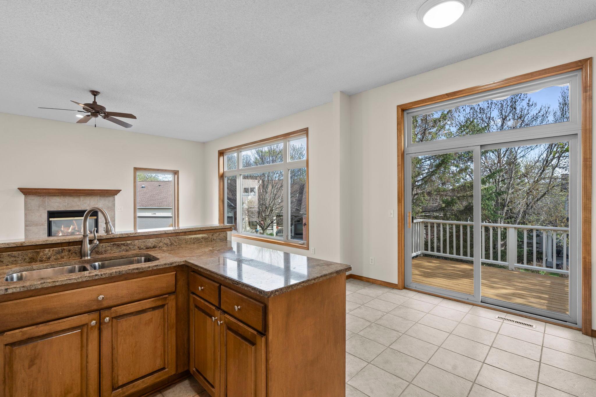 Large windows bring in a ton of natural light. Warm and open floor plan.