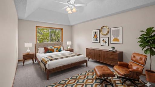 Spacious primary bedroom! Virutally staged to envision yourself relaxing in this space at home.