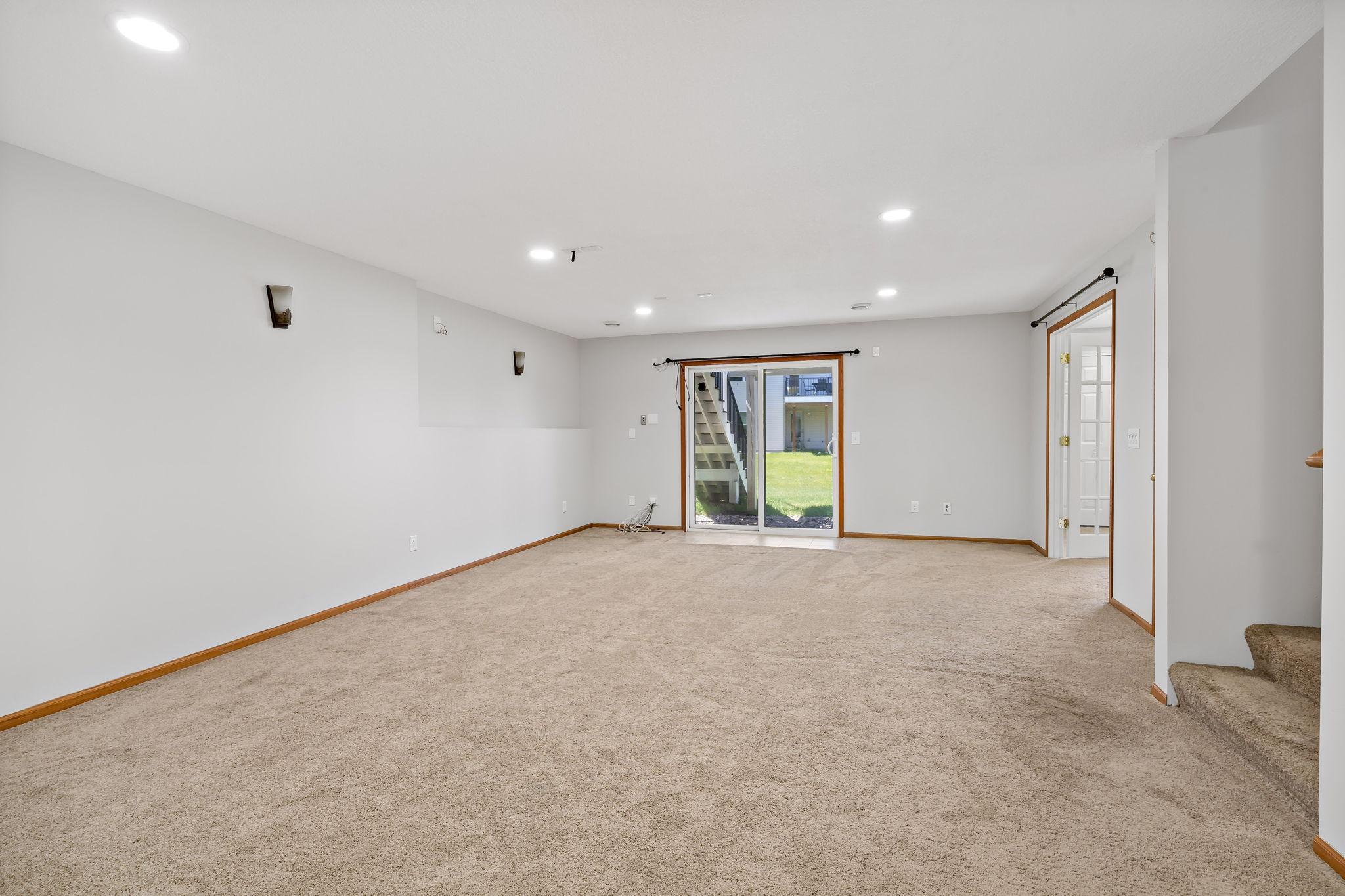 Huge lower level family room with sliding door