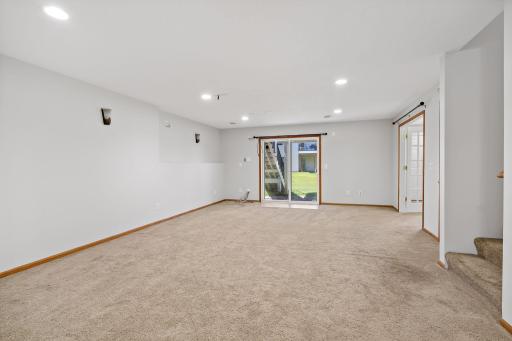 Huge lower level family room with sliding door
