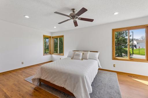 The second bedroom on the main level is spacious with oversized windows.