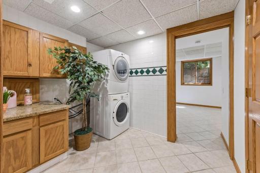 Laundry room on the lower level, with stacked washer and dryer.
