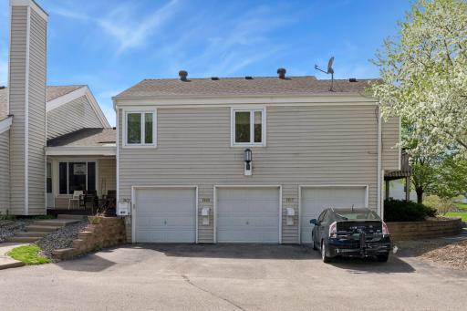 Convenient one-car garage with interior access, and additional parking spots available in the shared lot.