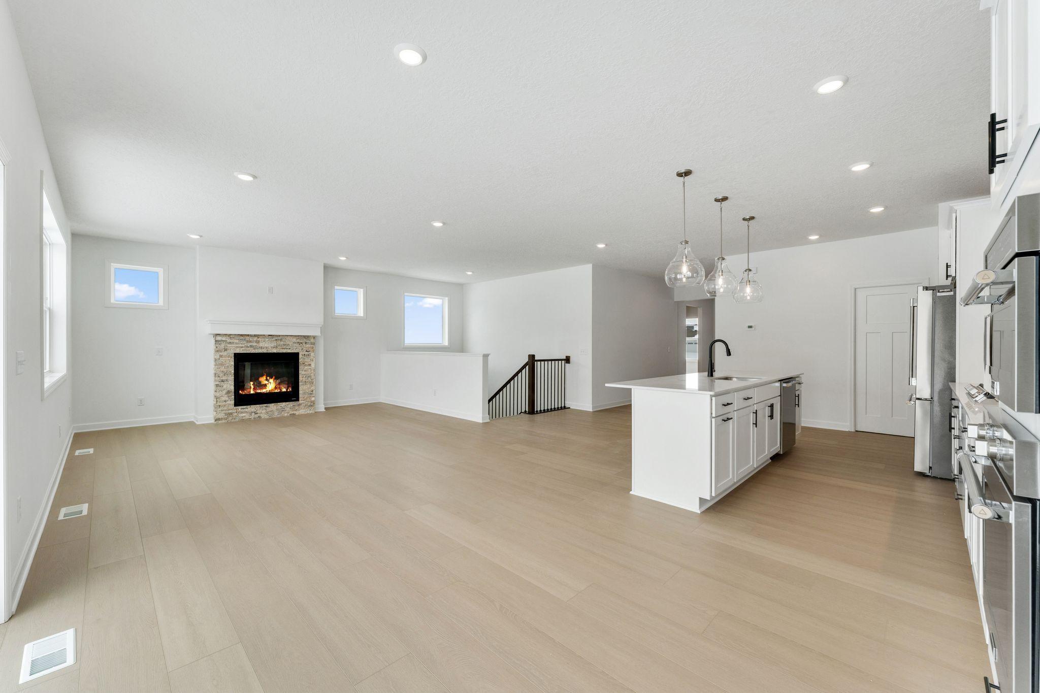 (Photo of a similar home, actual finishes may vary) Enjoy meals of any kind in the dining room, situated among the open floorplan for effortless flow between cooking, dining and relaxing.