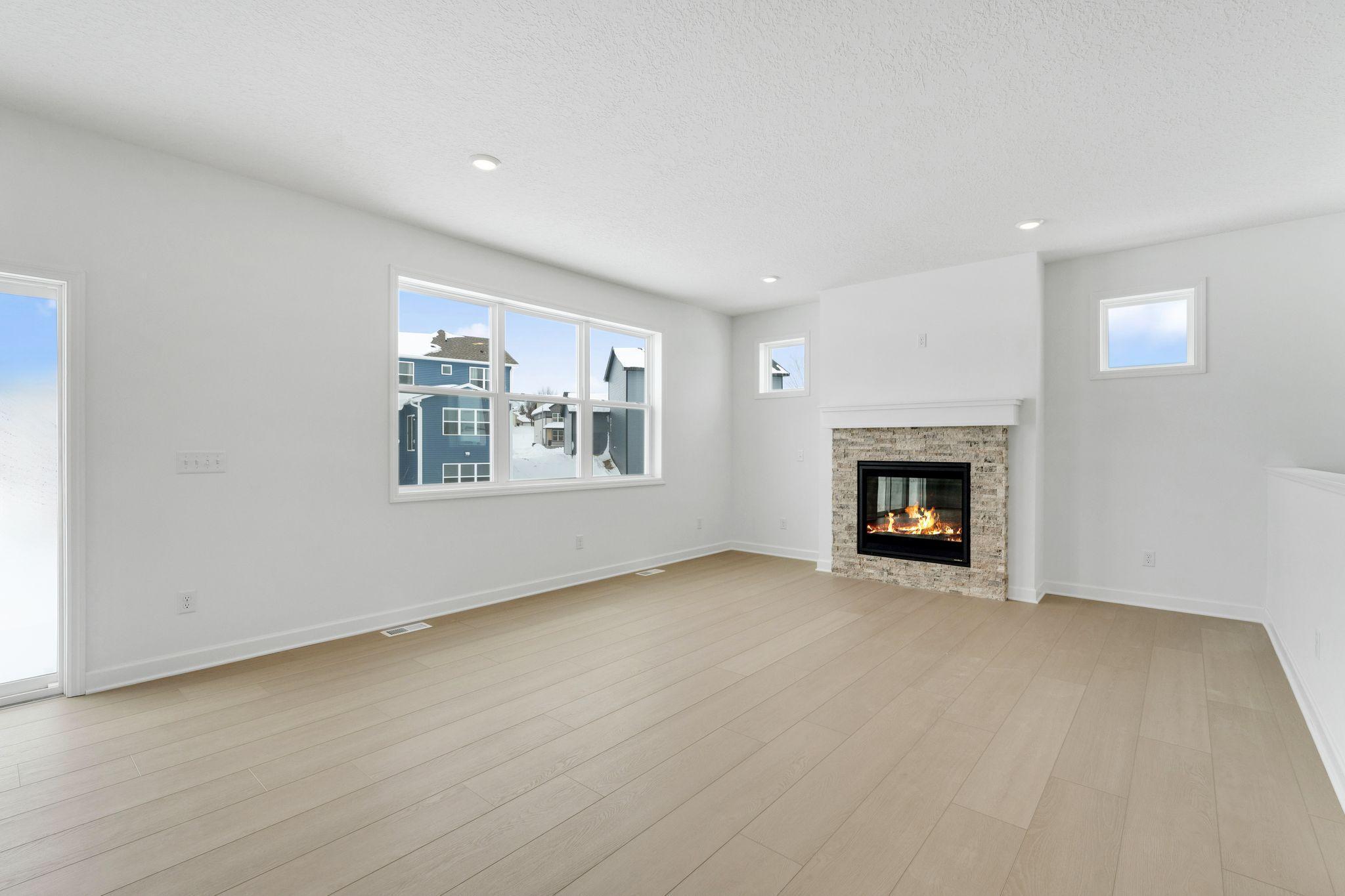 (Photo of a similar home, actual finishes may vary) A natural gathering place, the Great Room is a space for spur-of-the moment get-togethers and celebrations that flows seamlessly into the adjacent dining room and kitchen.