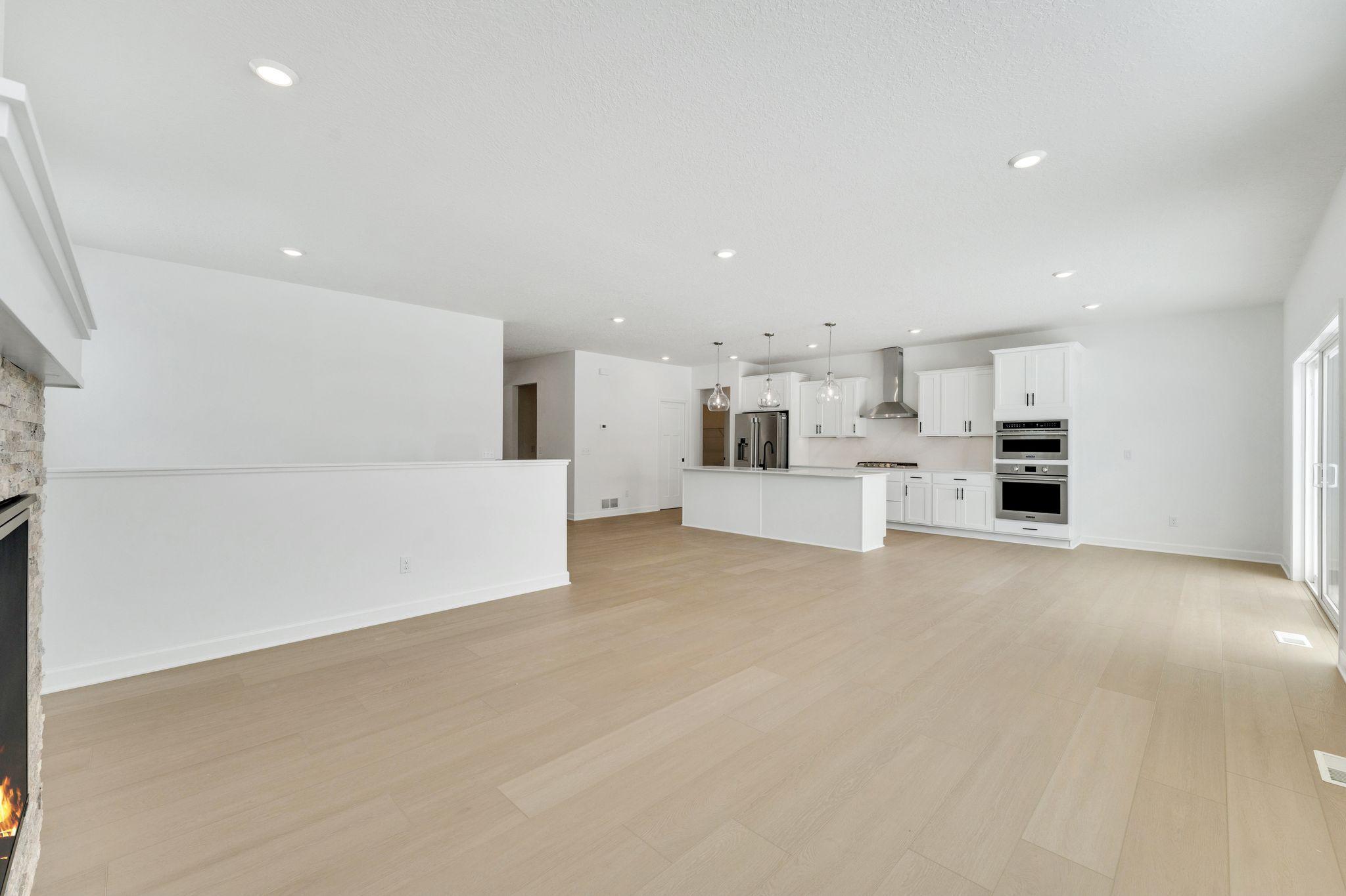 (Photo of a similar home, actual finishes may vary) The open floorplan allows for seamless flow throughout the home.