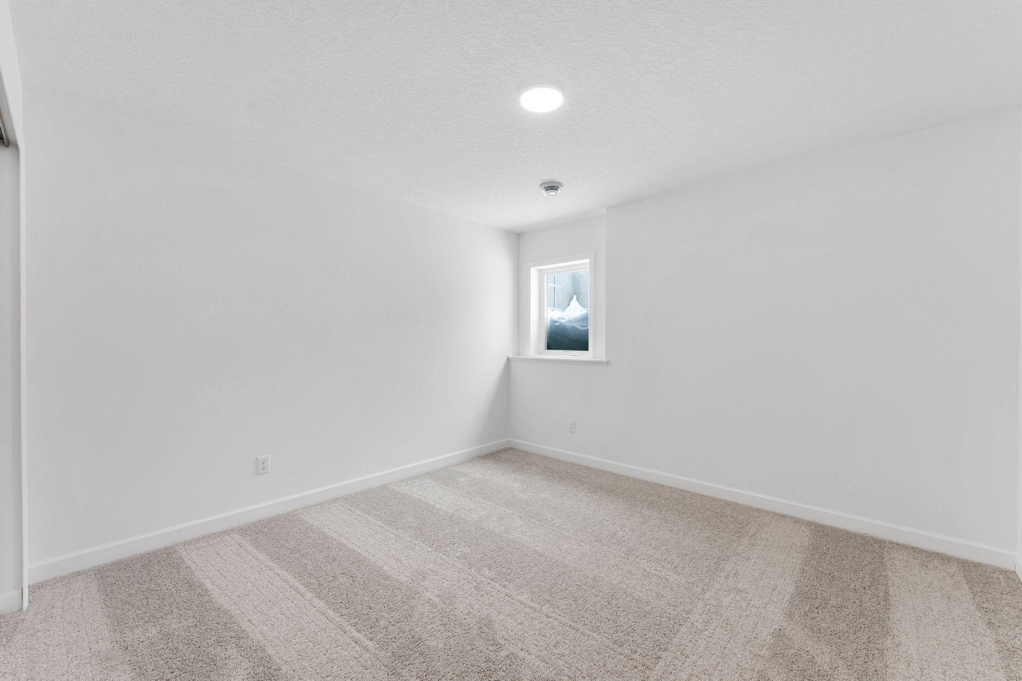 (Photo of a similar home, actual finishes may vary) This fourth bedroom is perfect for hosting visiting relatives or family members that crave privacy