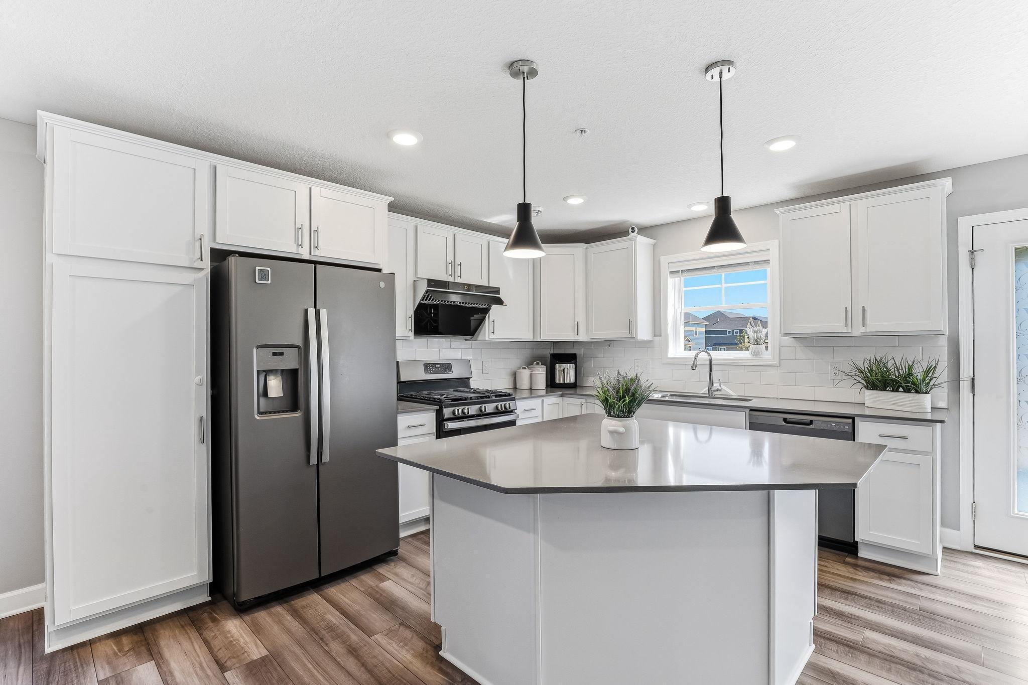 Modern kitchen with a sleek center island-1136-Middlefield-Rd-09.jpg