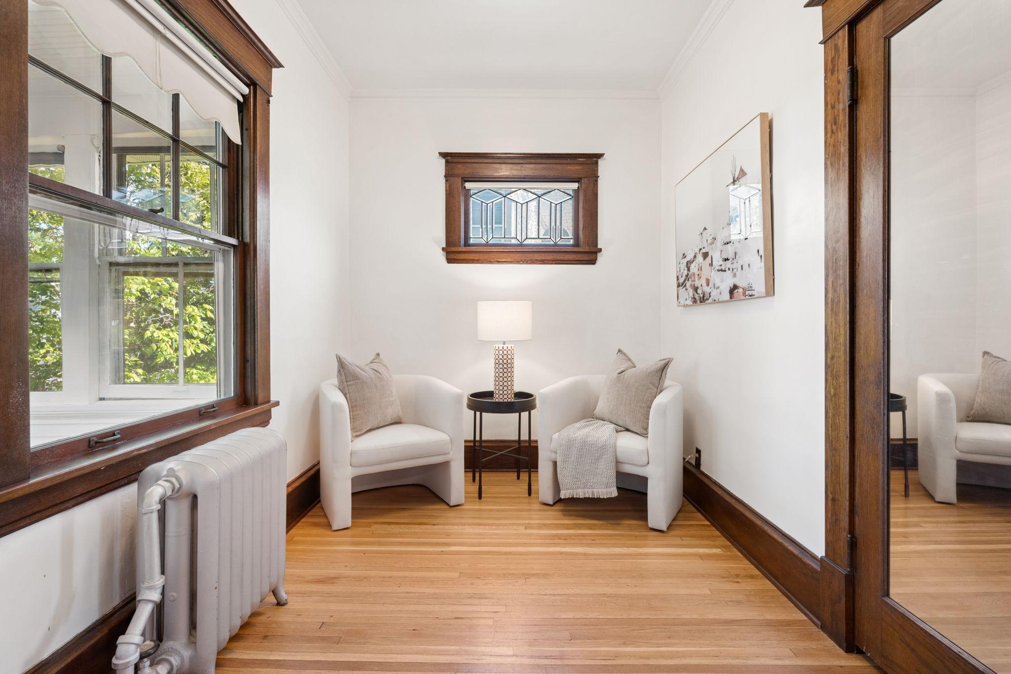 Front sitting room is the perfect spot to cozy up with a good book. Would also be ideal for a home office!