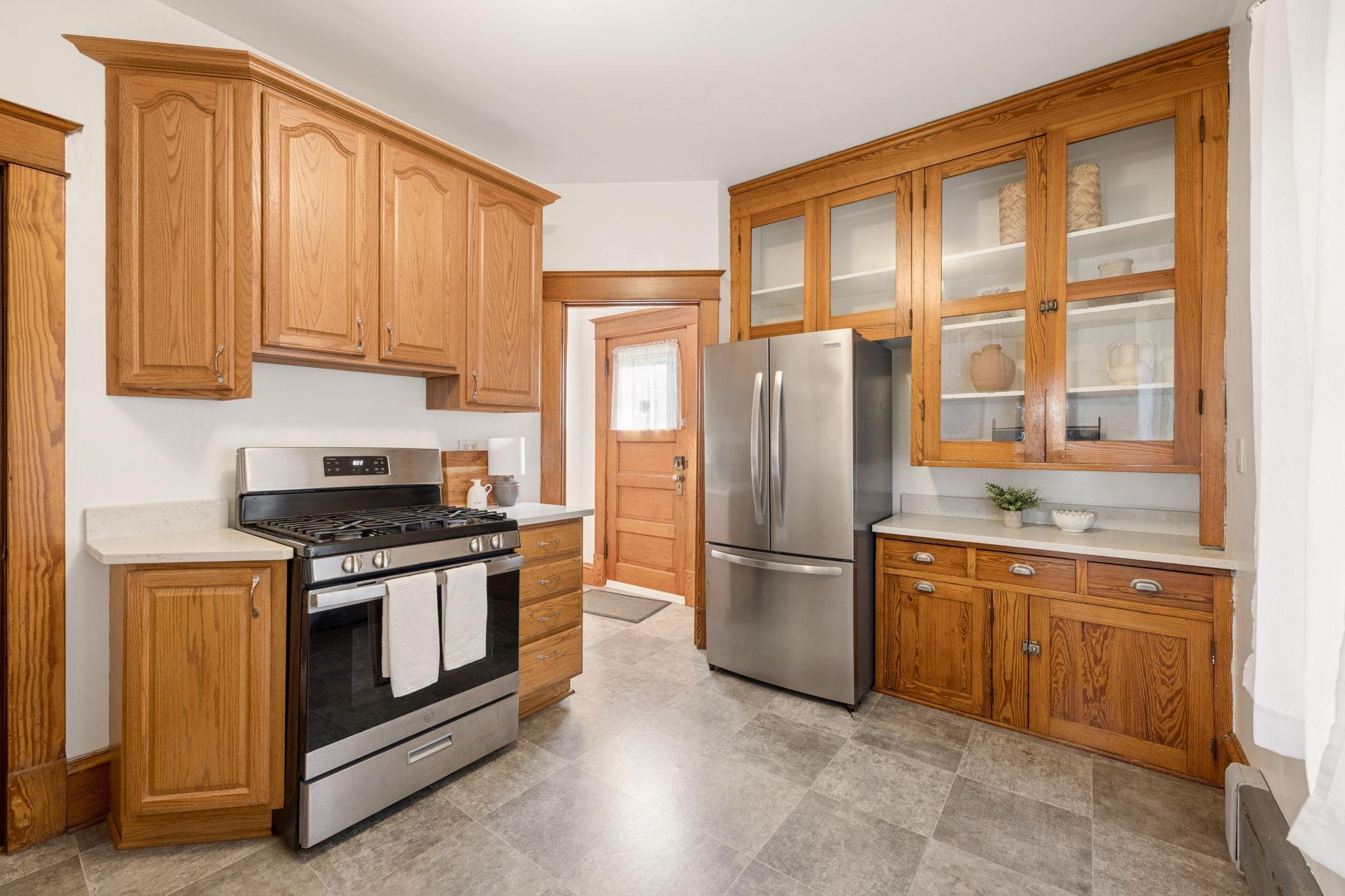 The updated kitchen includes ample storage space for all of your kitchen appliances & tools, stainless steel appliances and quartz countertops.