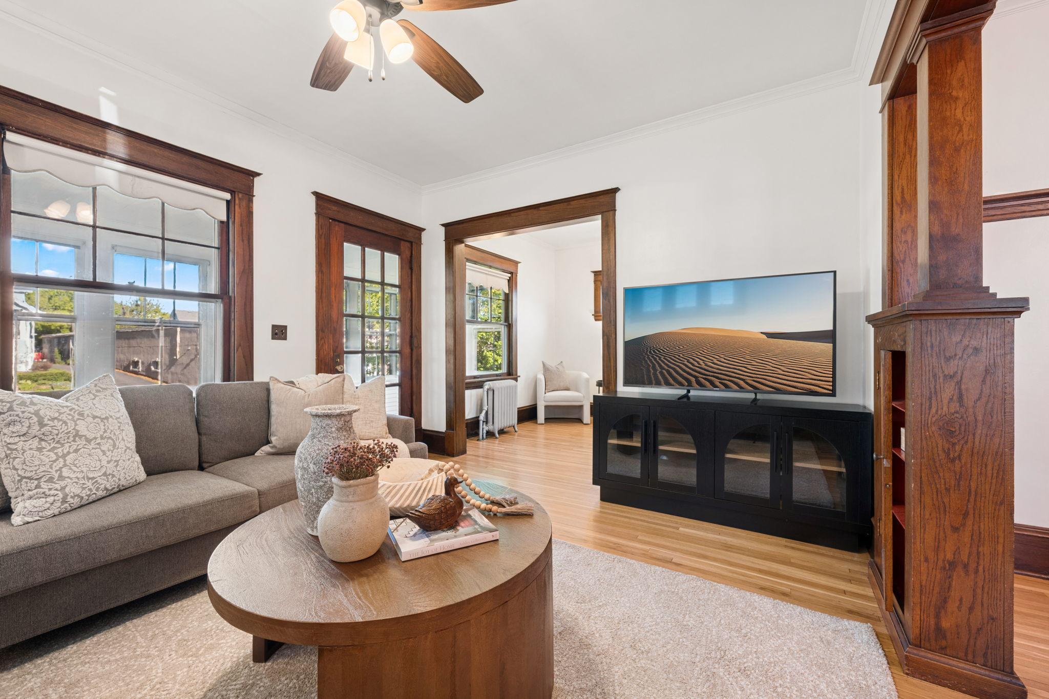 Large windows flood the rooms with natural light.