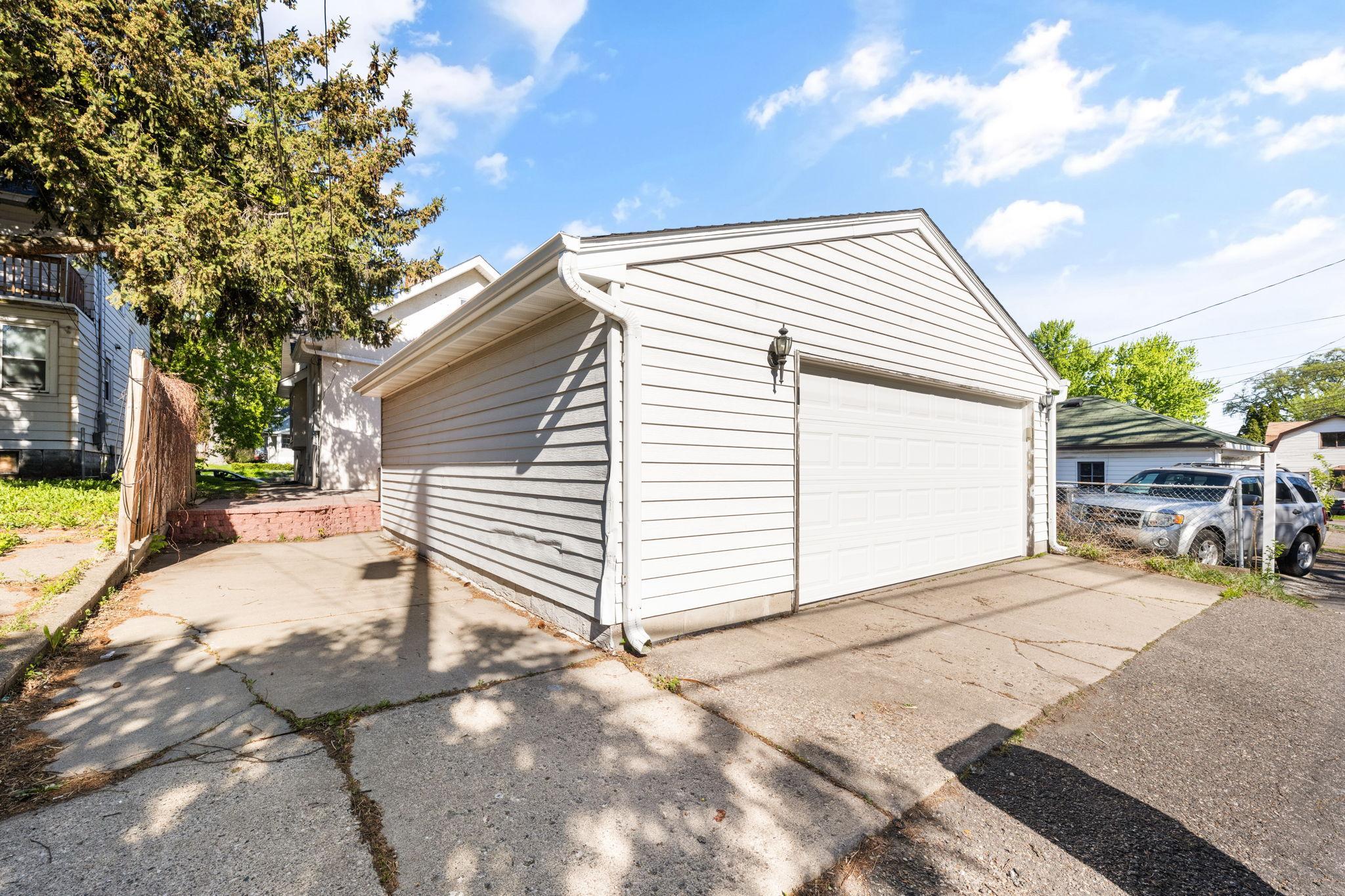 Newer oversized 2 car garage offers additional storage space.