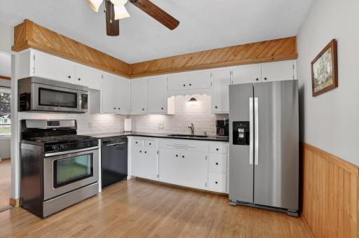 Comfortable kitchen with newer appliances and granite countertops