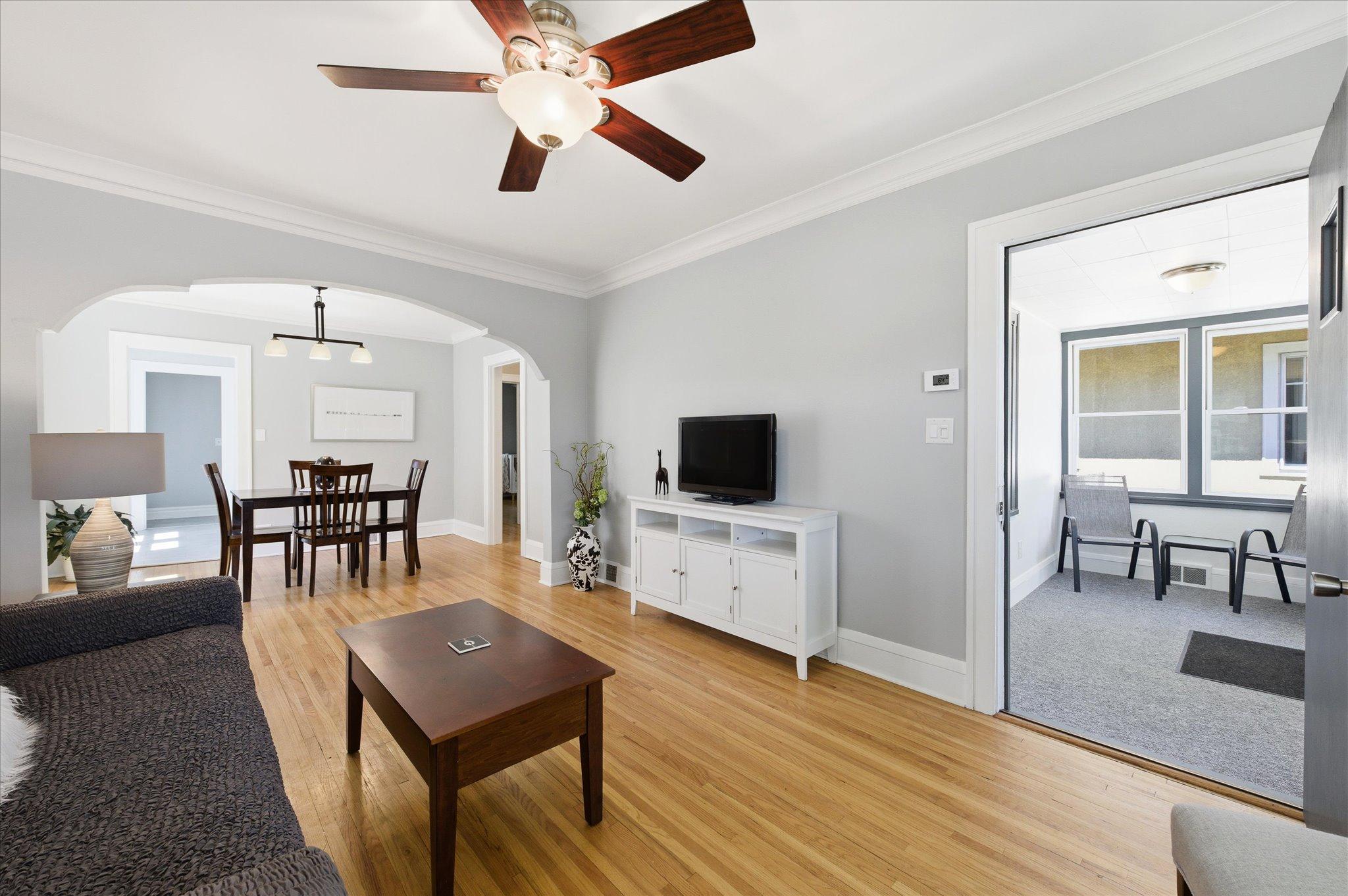 You’ll appreciate the functional layout connecting the living room to the dining area while offering easy access to the screened porch.