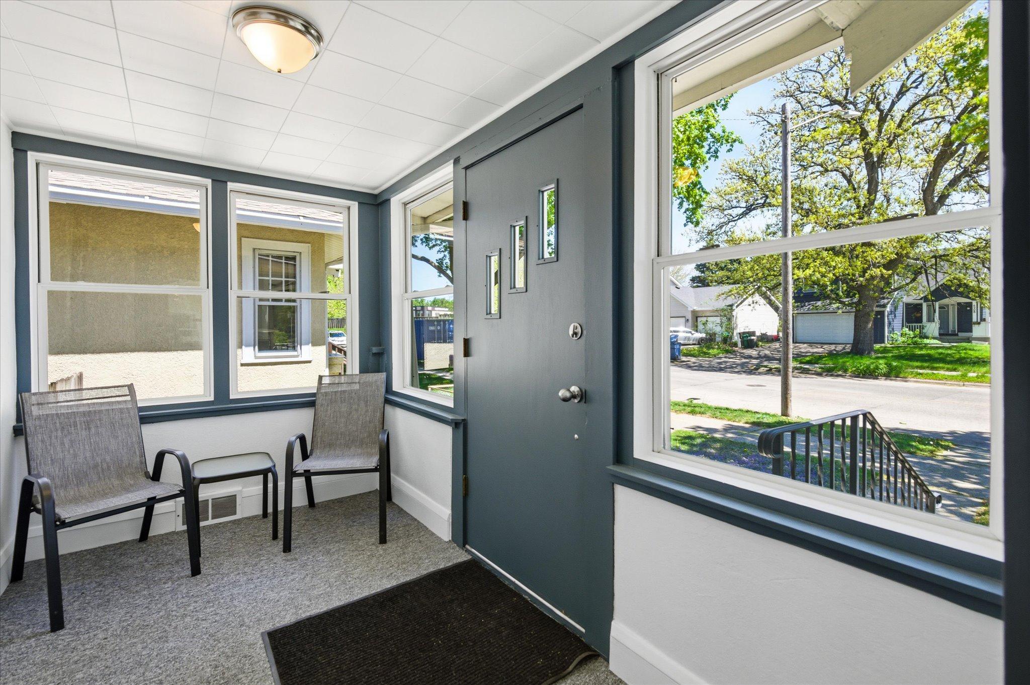The screened porch creates the perfect welcoming space to start your mornings with coffee or unwind after a long day.