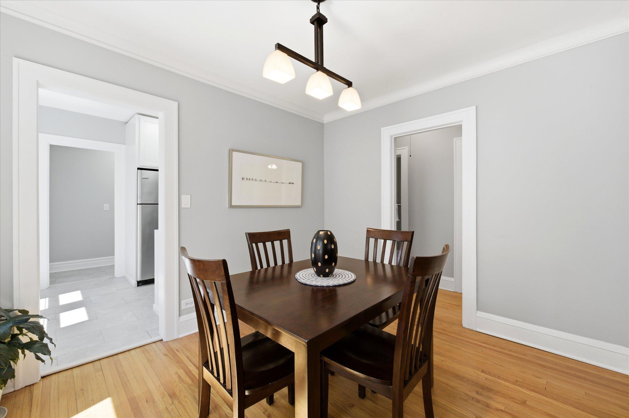 Another look at the dining area highlights the home’s classic charm and functional flow.