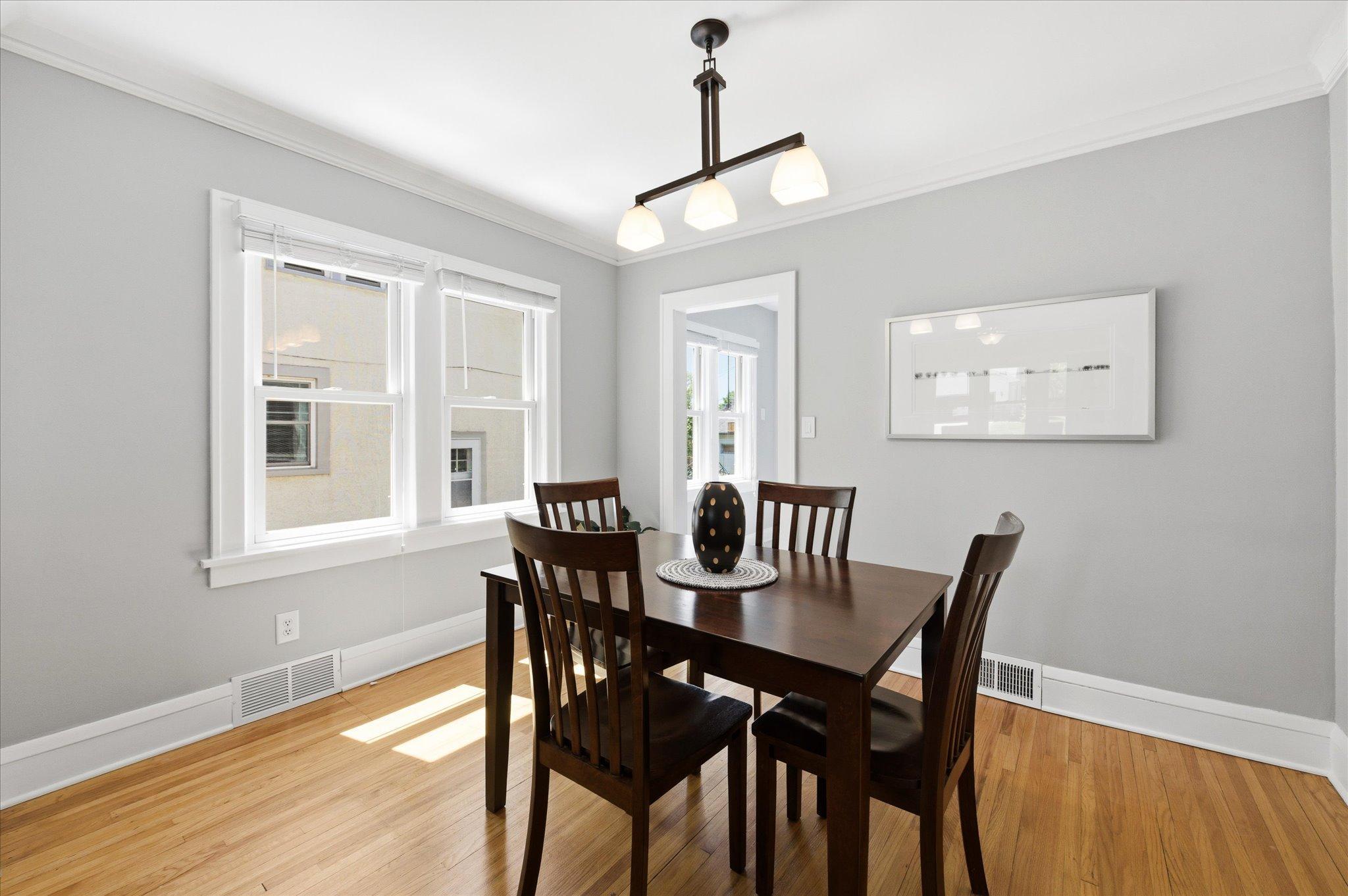 Sunlight fills this inviting dining room, creating the perfect atmosphere for intimate dinners, holiday gatherings, or casual mornings at home.