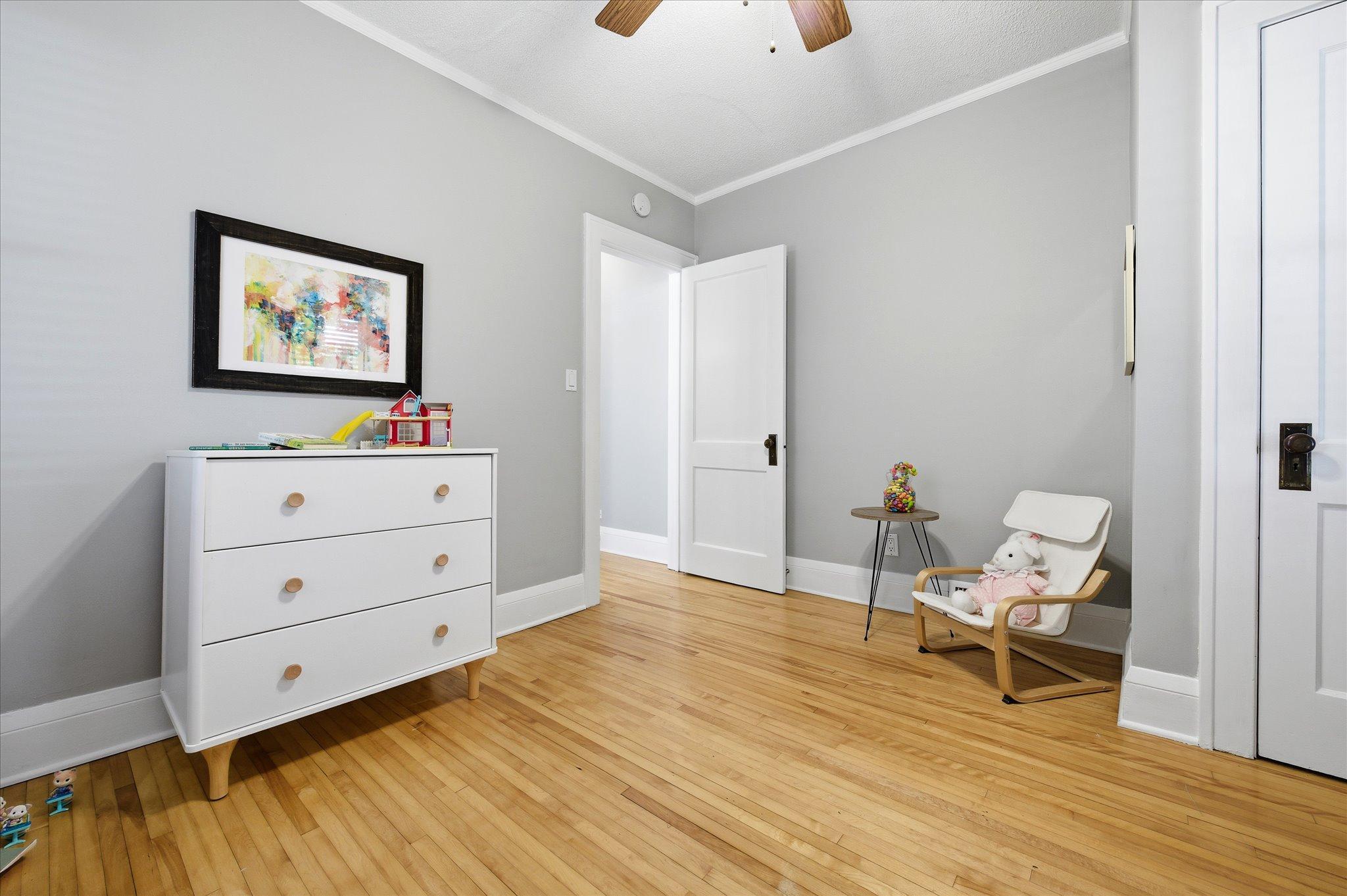 Spacious and inviting, this second bedroom offers flexibility for a variety of uses while maintaining the home’s warm character.