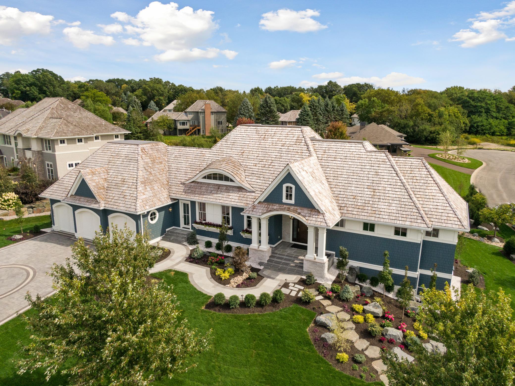 Charming curb appeal and beautiful landscaping greets you