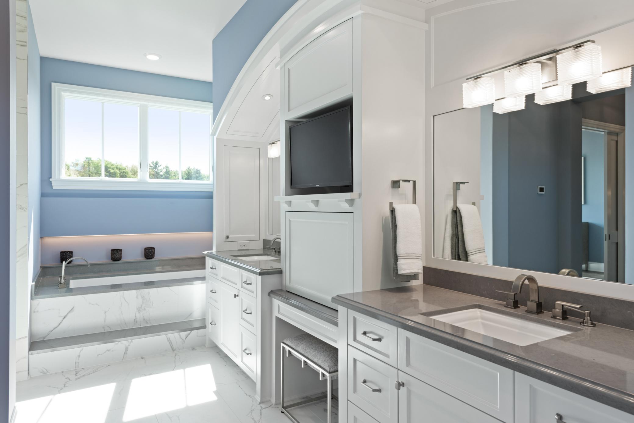 Primary bathroom features double sinks, dual vanities, and tons of natural light