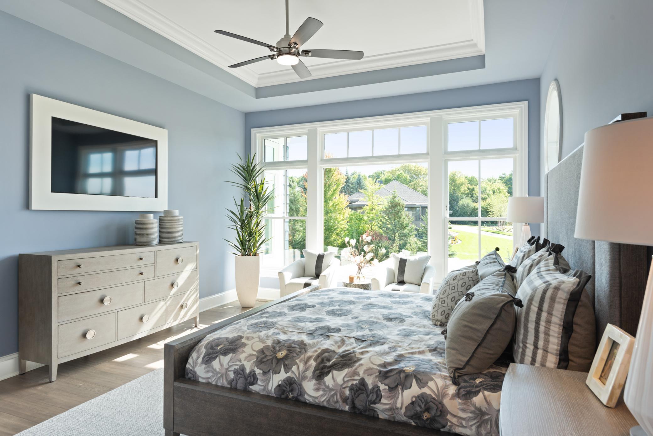 Tons of natural light floods this primary bedroom