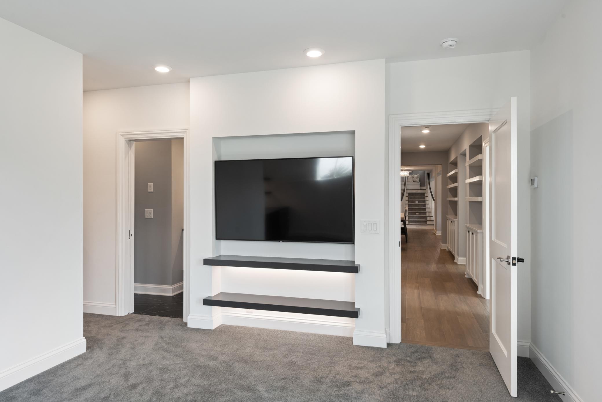 Second bedroom with tv niche, and additional shelving for storage