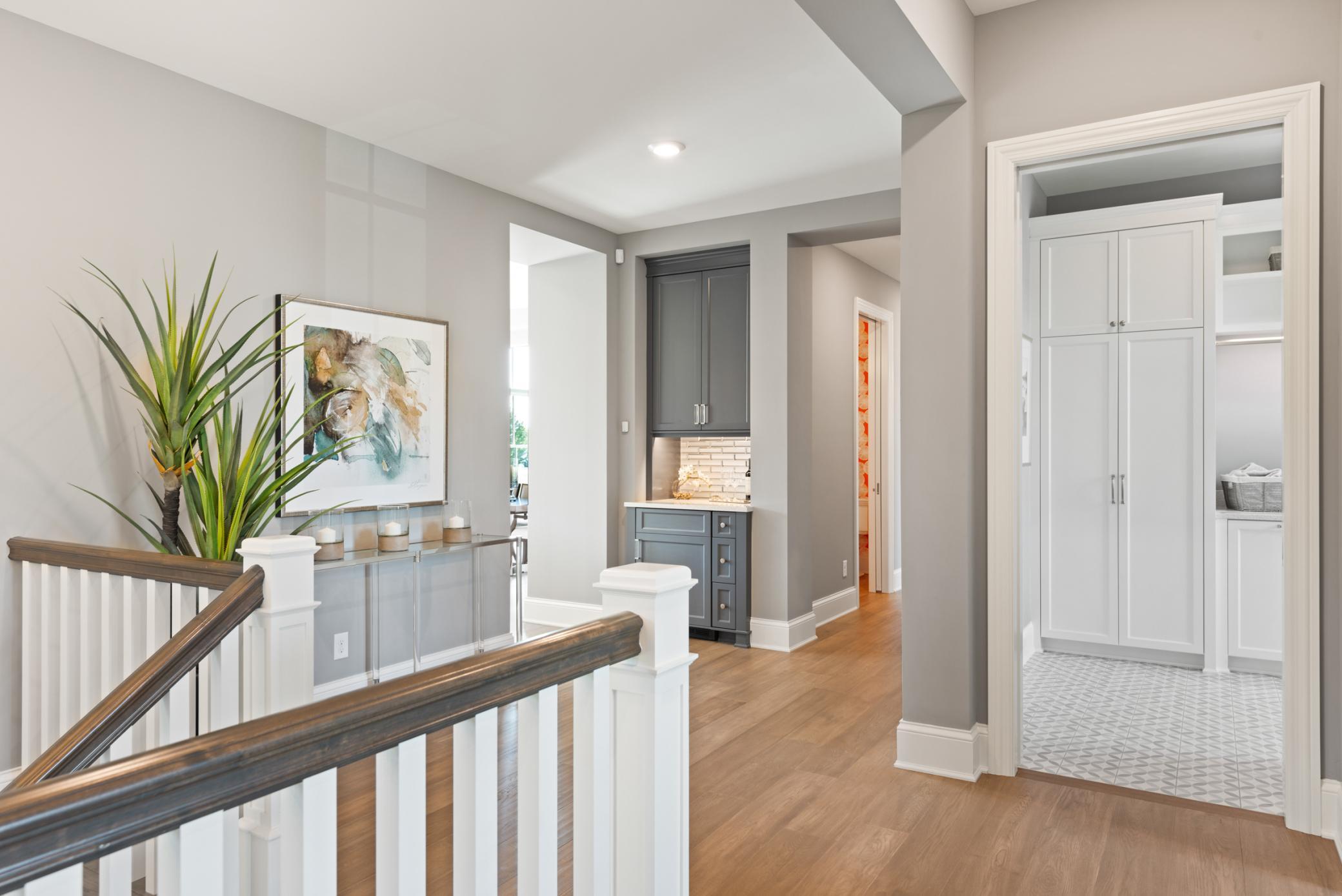 Additional storage closets, laundry, and spacious mudroom complete the main level