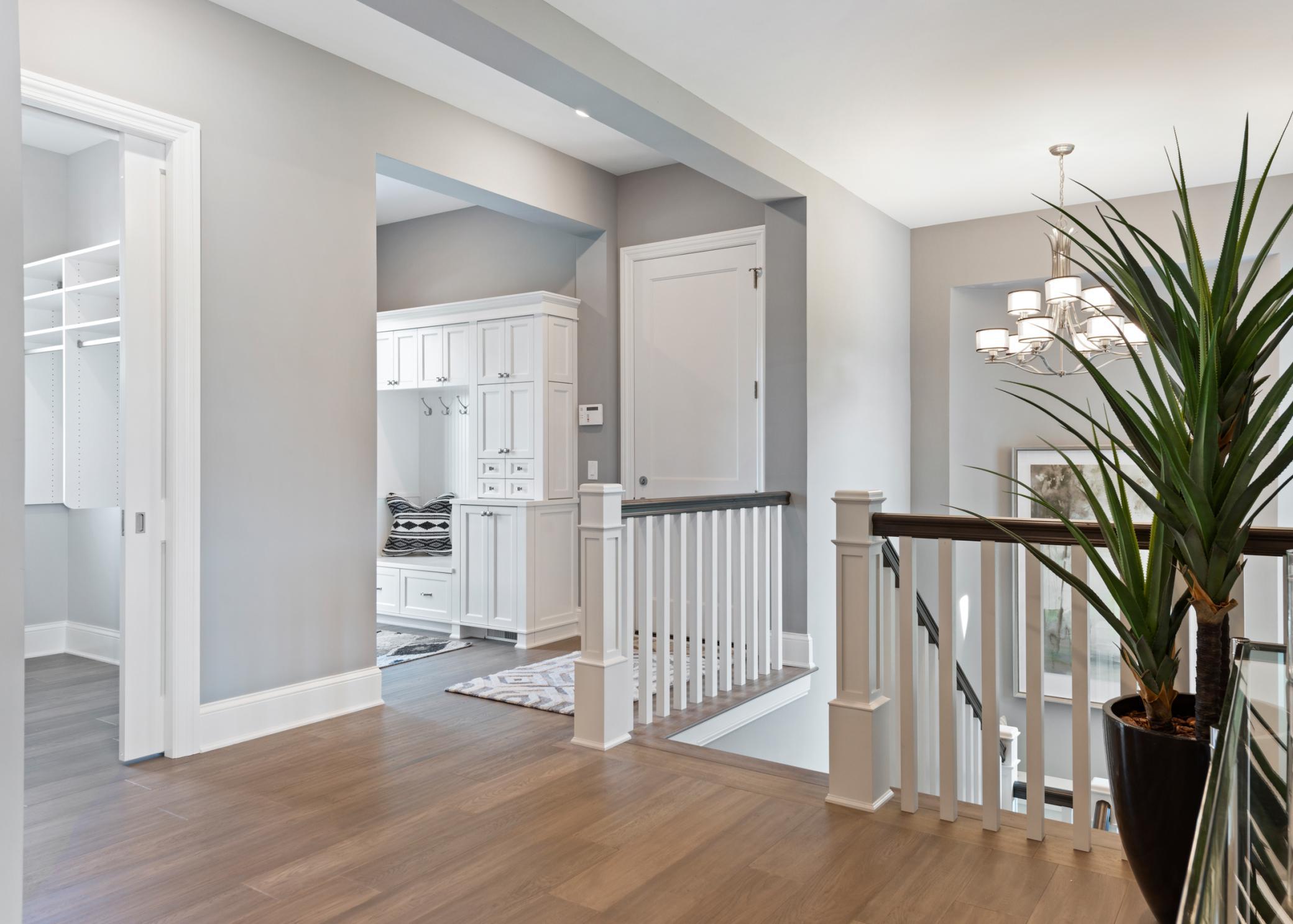 Additional storage closets, laundry, and spacious mudroom complete the main level