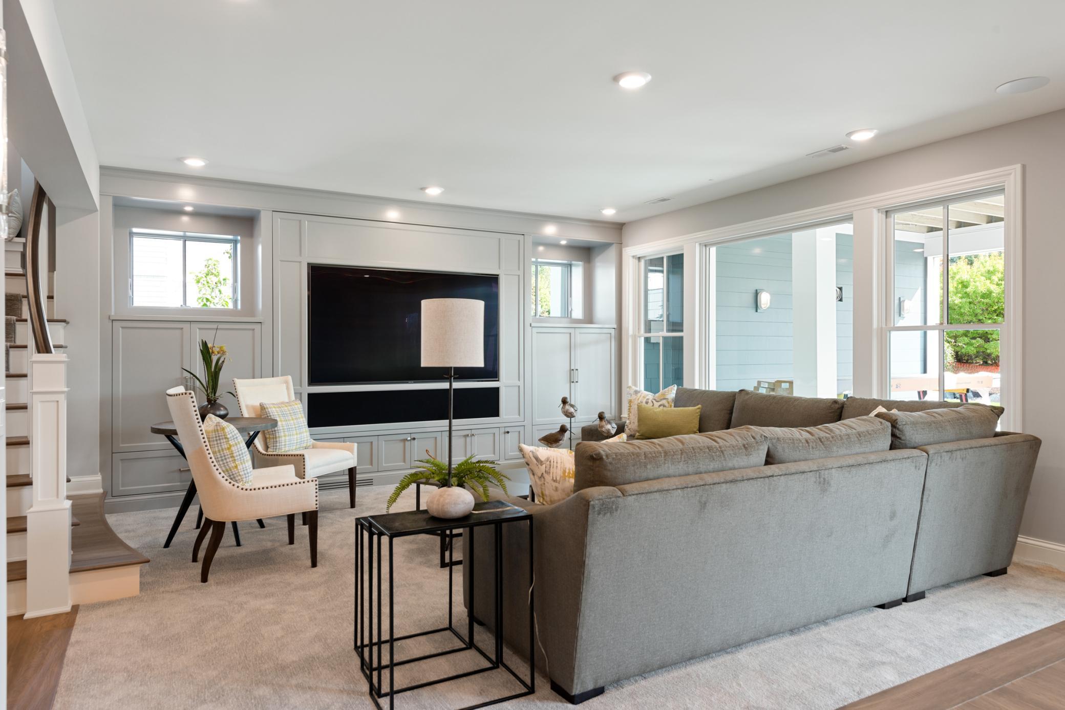 Lower level family room with custom built-ins and entertainment space
