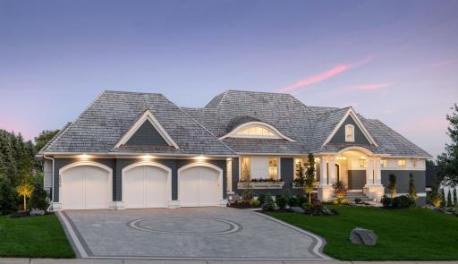 Charming curb appeal and beautiful landscaping greets you