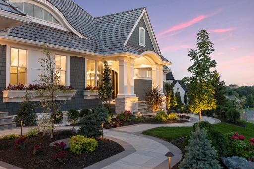 Stunning entryway to greet guests with solid stone steps and barrel vault porch