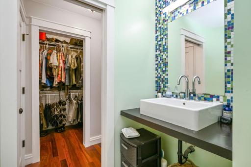 View of the walk-in ownerâs suite closet from the en suite bath